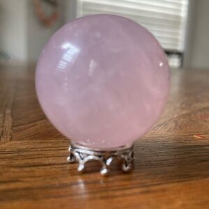 Cute miniature rose quartz sphere on stand